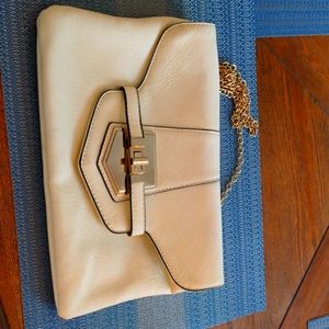 Cream and black crossbody purse with gold chain